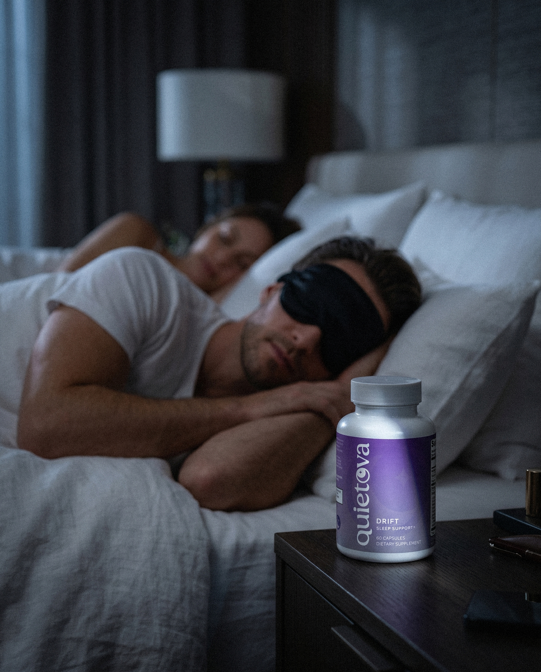 man-sleeping-with-quietova-drift-on-nightstand.jpg